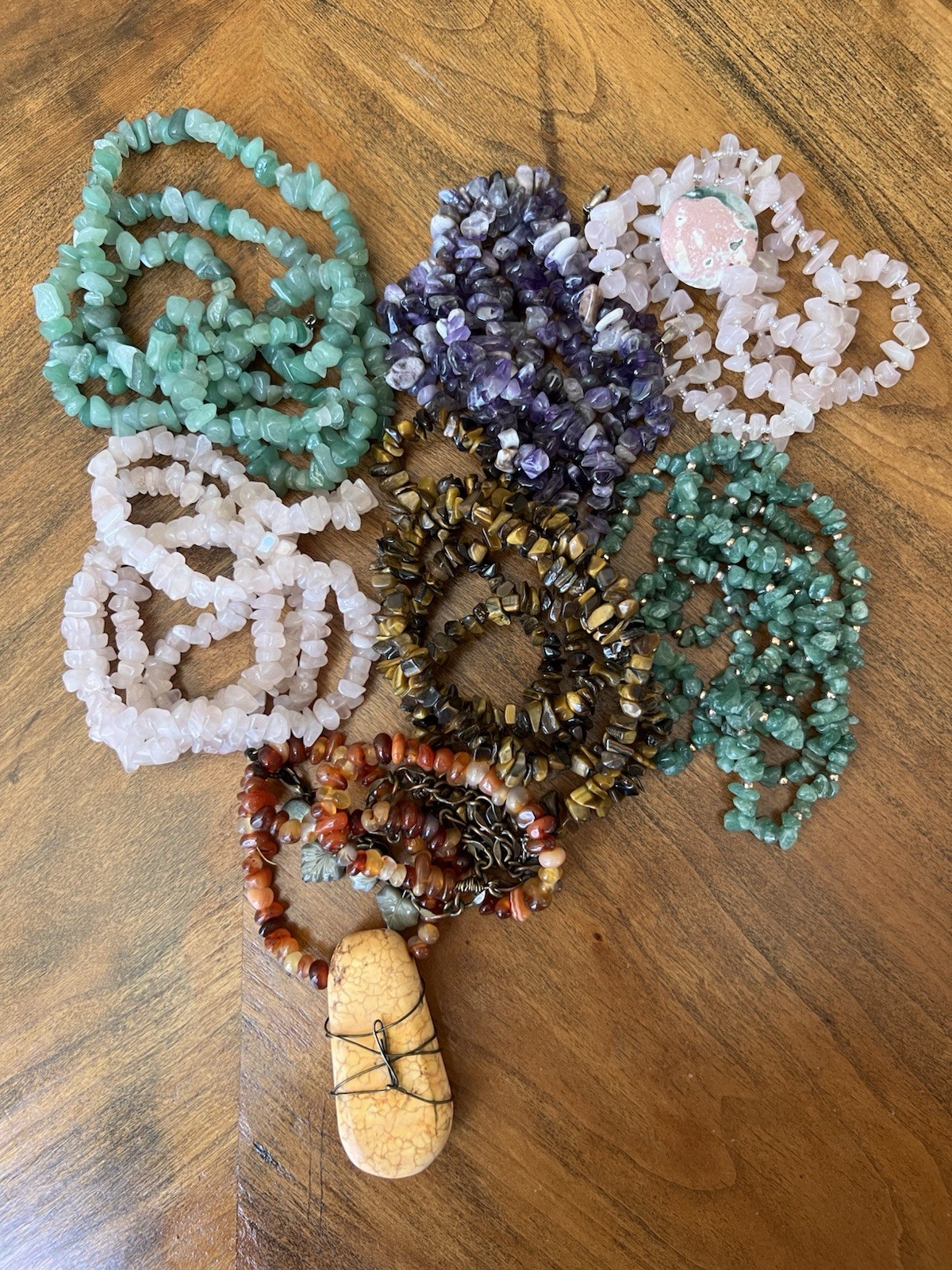 Spectacular lot of natural stone necklaces in pink, green, and brown