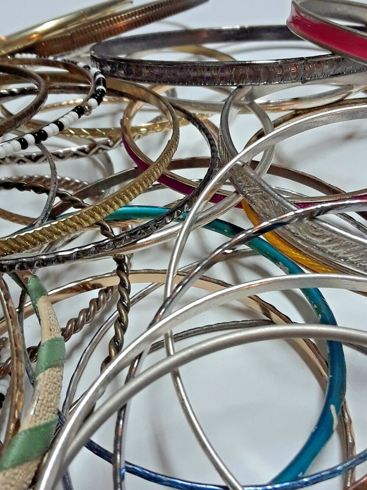 Bangle bracelets. gold tone silver tone, metal, plastic, with patterns. Lot