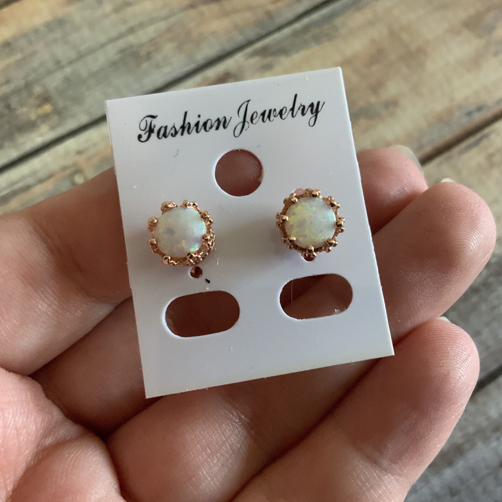 Man made faux opal crown setting rose gold colored stud earrings