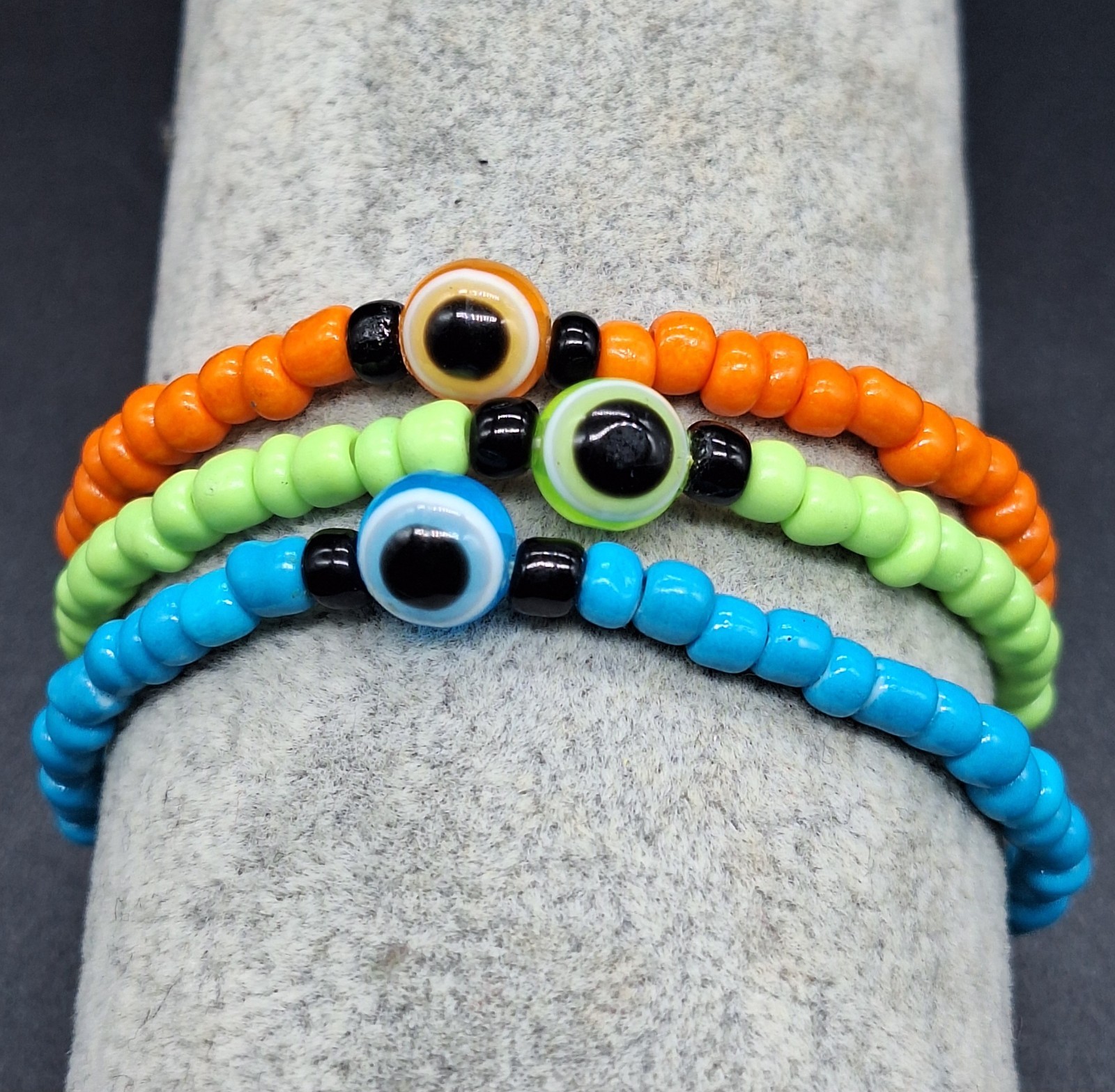 Set of Three Orange Green and Blue Handmade Bracelet w Seed Beads and Black Eye
