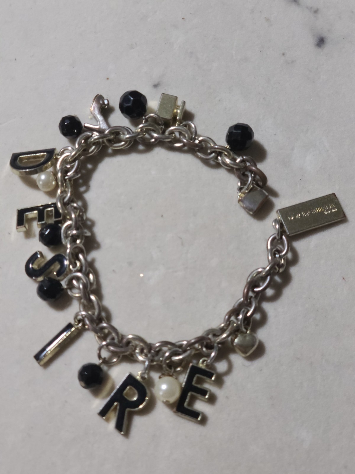 DOLCE AND GABBANA CHARMS BRACELET GOLD TONE DESIRE NEEÐ BRACELET CLASP REPAIR