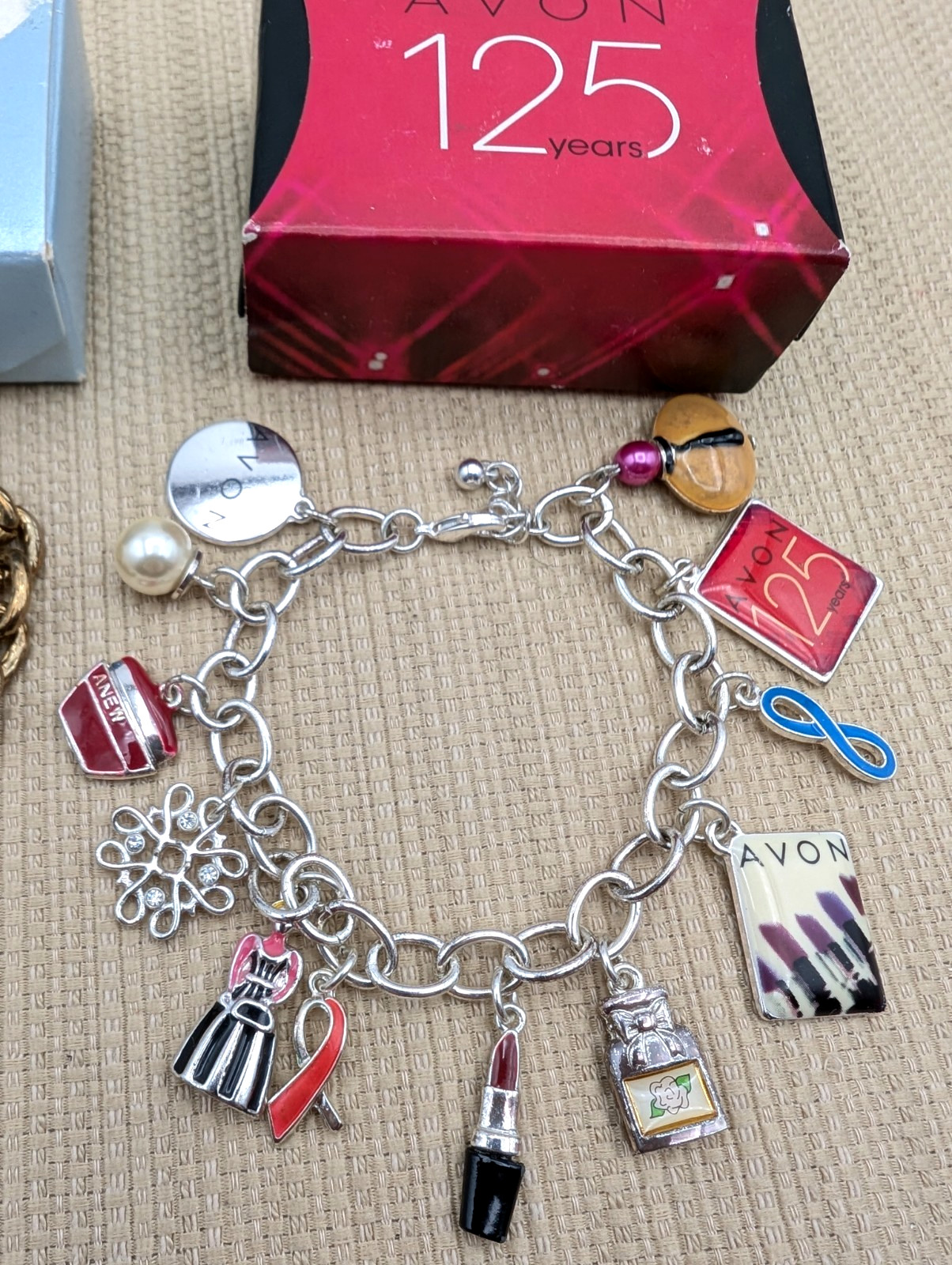 2 Avon Representative Charm Bracelet-125th Anniversary & David H McConnell Award