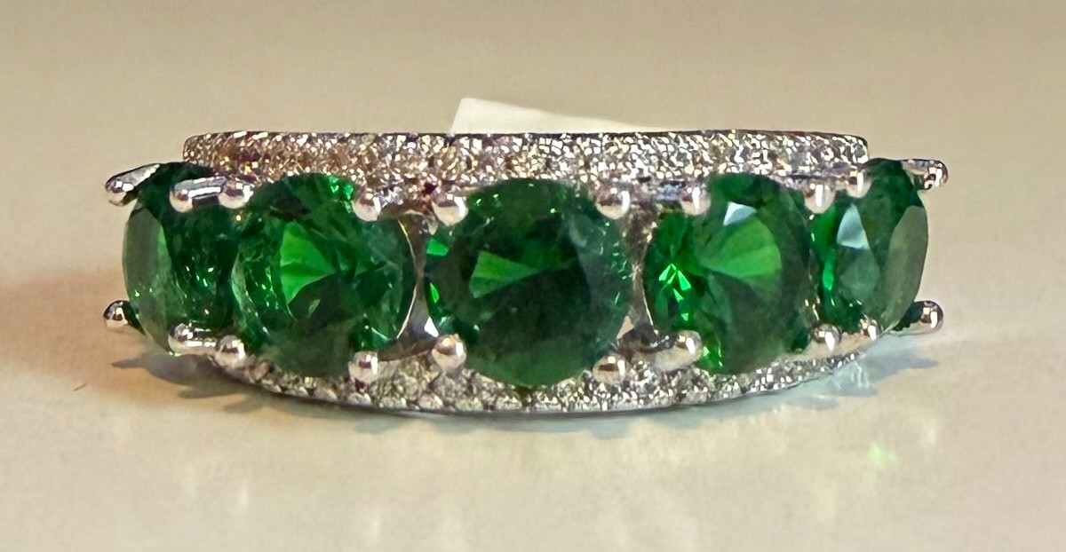 Simulated green diamond ring set in silver tone, size 8.5