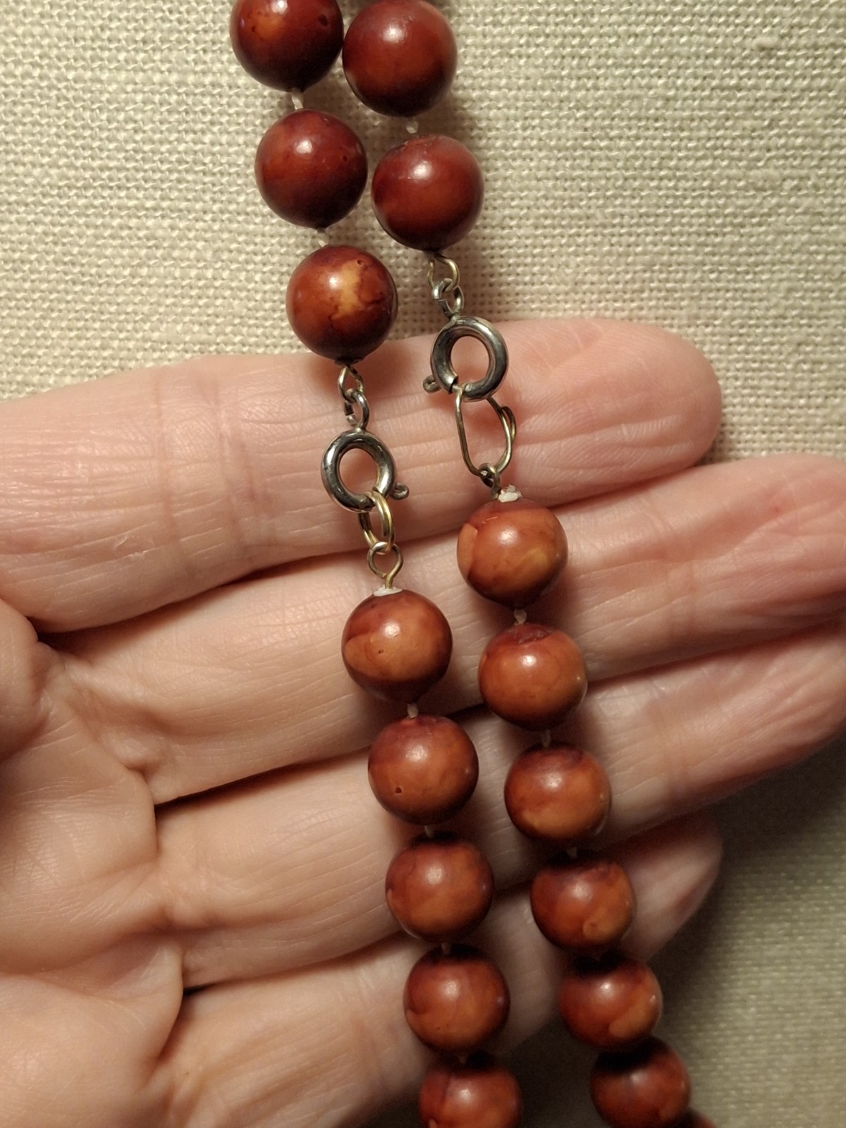 Pre-owned no brand 2 necklaces..reddish brown, orange faux wood beads