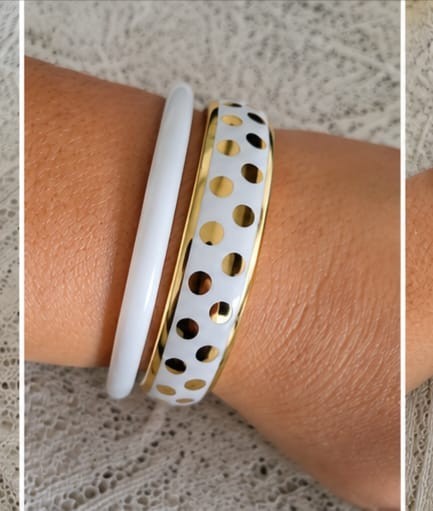 A modern and elegant bracelet set consisting of three white bracelets with gold
