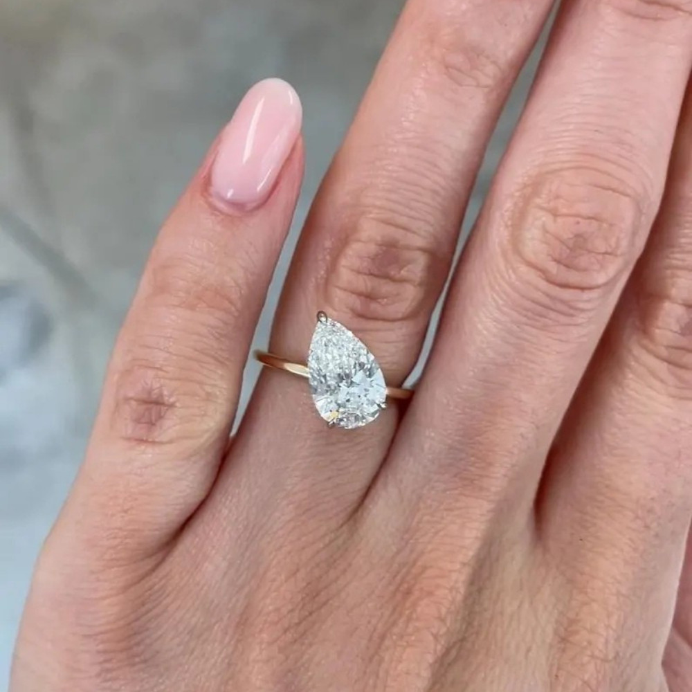 Tilted Pear Moissanite Solitare Set to Side Engagement Ring 1.25 mm 2Ct