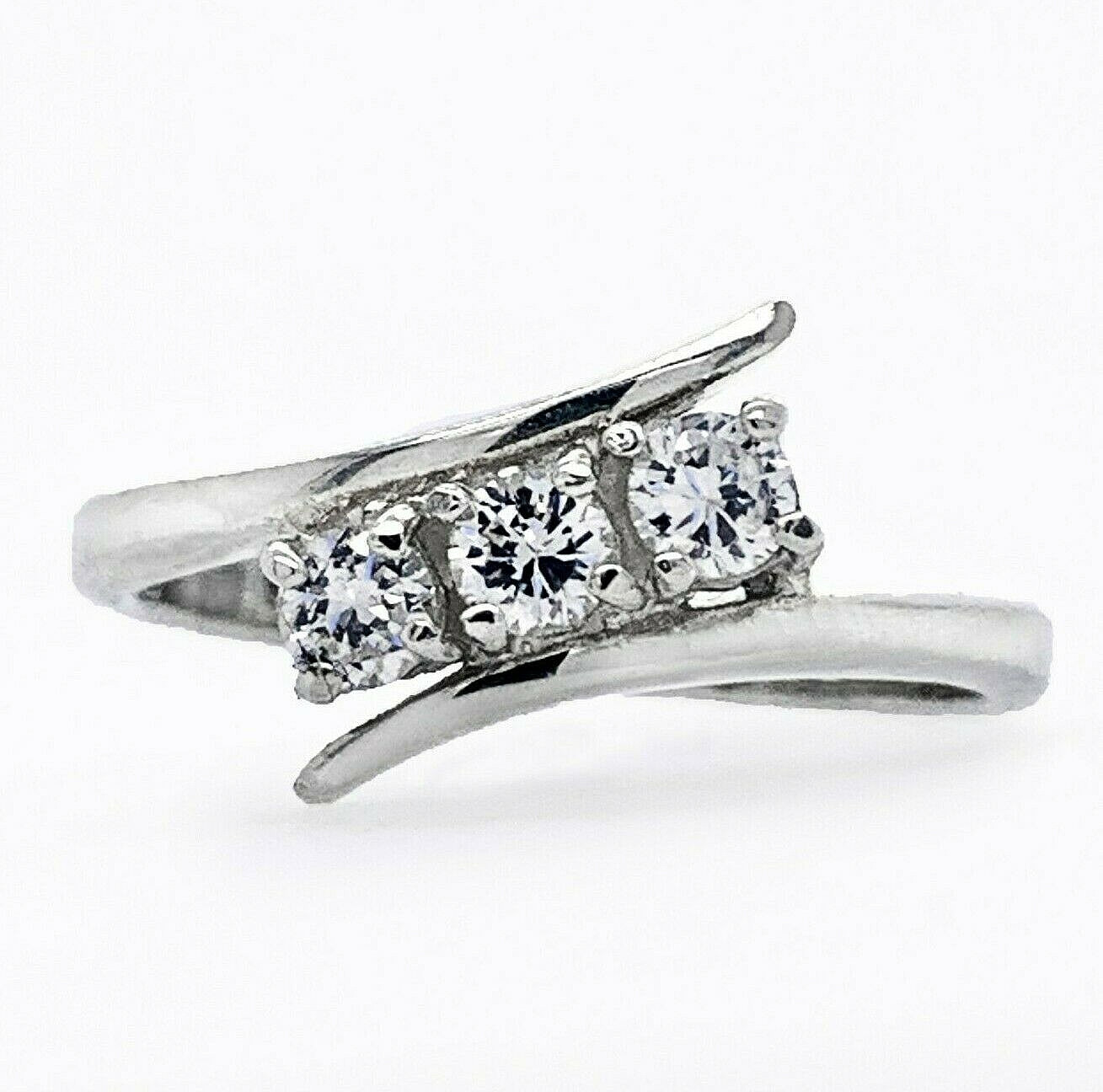 Sterling Silver Three Stone set round Brilliant cut cz swirl diagonally Ring