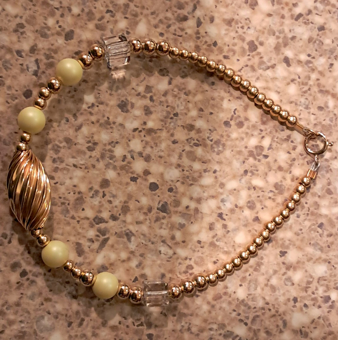 Gold Tone Cream Round Beaded Bracelet.
