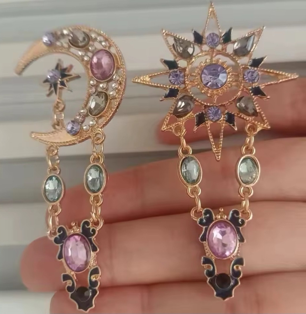 Gold Tone Asymmetrical Celestial Sun Star Moon Dangle Earrings, Purple Crystals