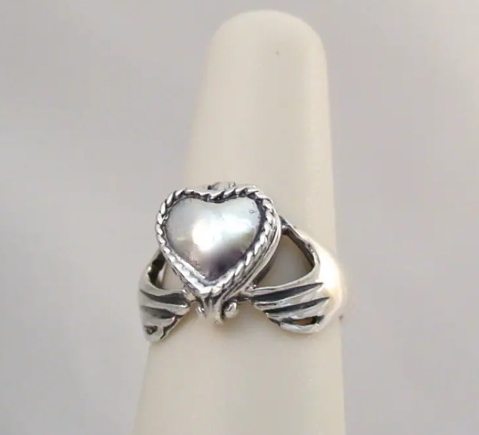 Heart in hand silver claddagh locket ring