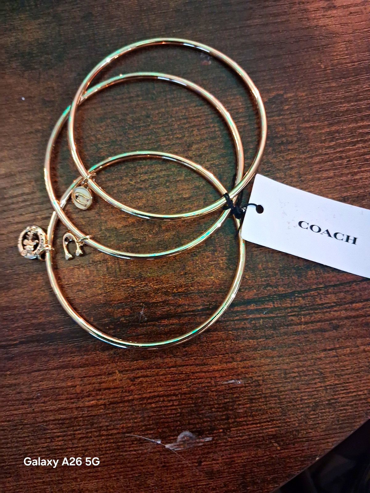 Coach NWT Gold Tone Stackable Bangle Bracelet Set, 3pc Logo With Dangle Charms