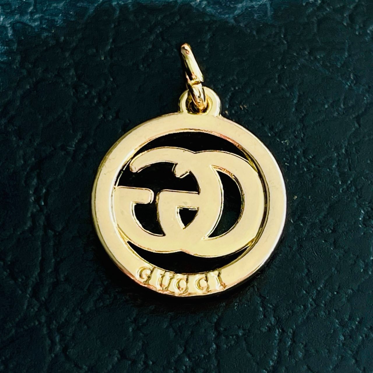 One Gucci Pendant rinestones stamped