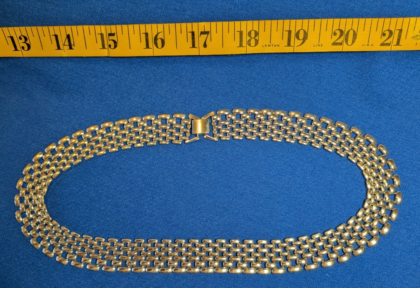 silver-tone metal necklace – bright color – used – unbranded – fold-over clasp