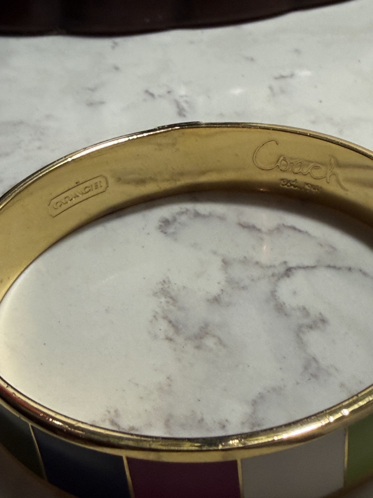 Coach enamel Goldtone w logo colored striped bangle bracelet