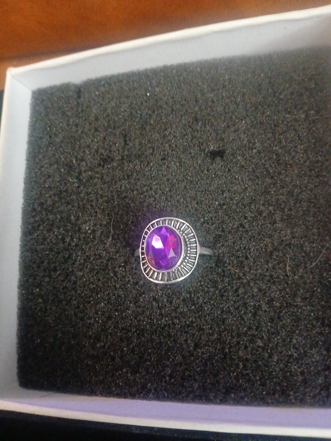 Free shipping,size 8 ring silver tone withan amazing purple stone. very elegant