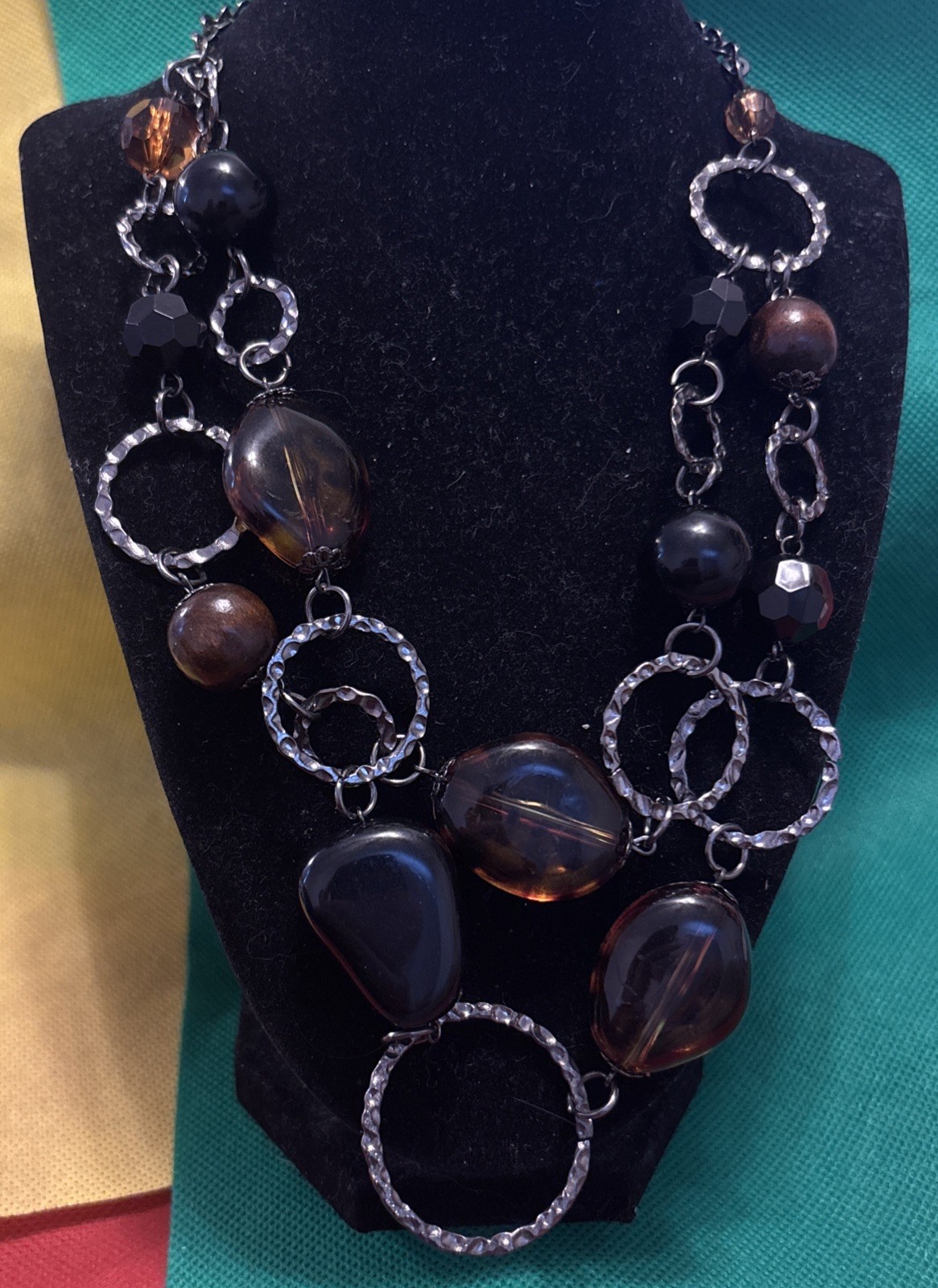 brown and black costume jewelry necklace with various glass or acrylic beads
