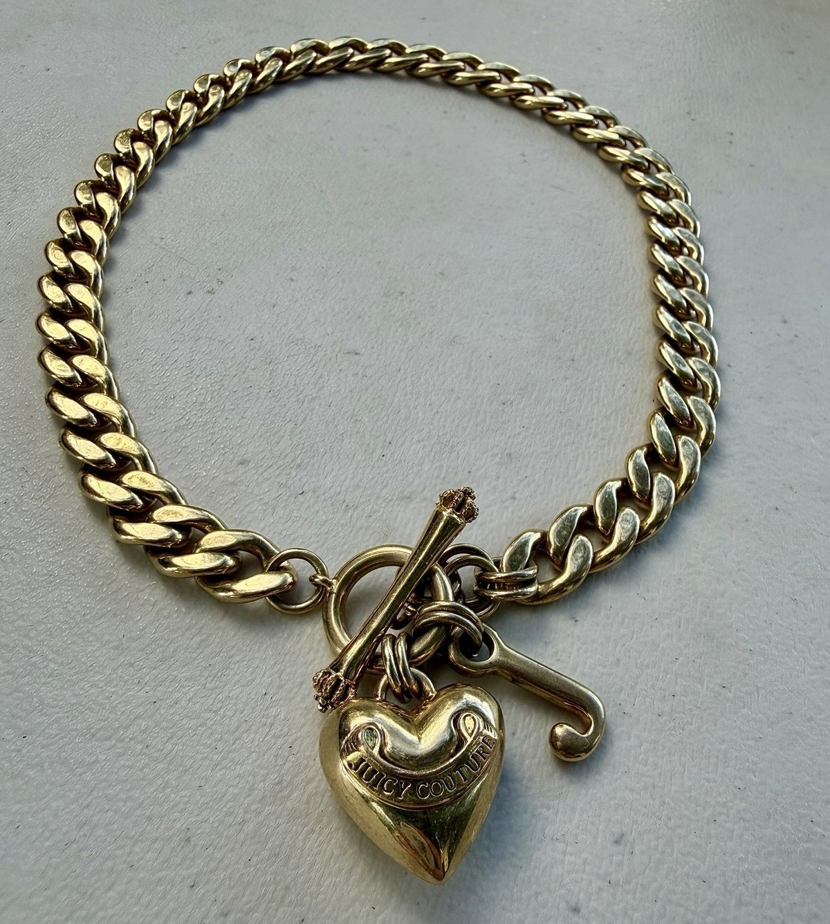 Juicy Couture Gold Tone Curb Link Toggle Chain Necklace with Heart Charm