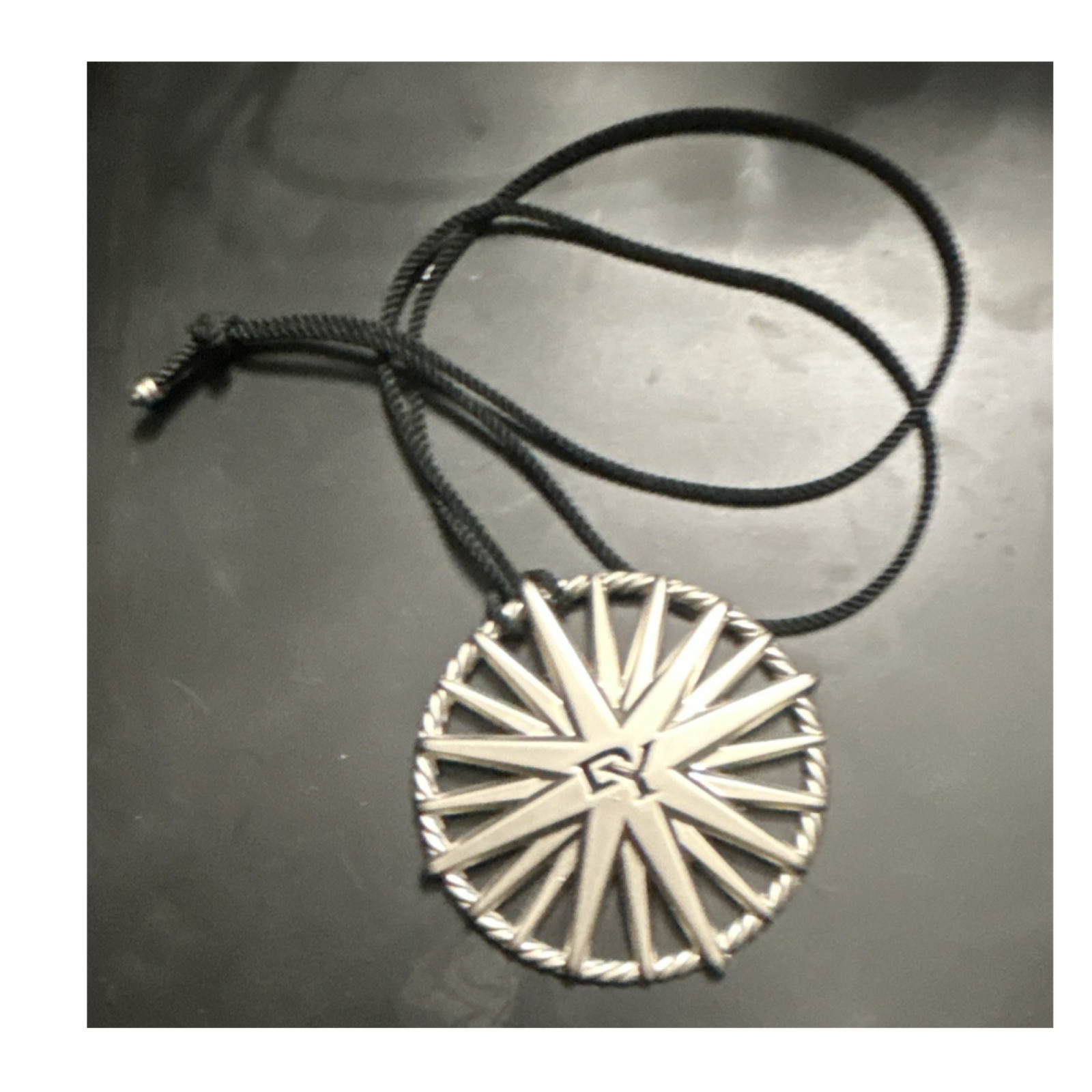 David Yurman Round Silver Metal Pendant Necklace with Black Cord Tie Closure