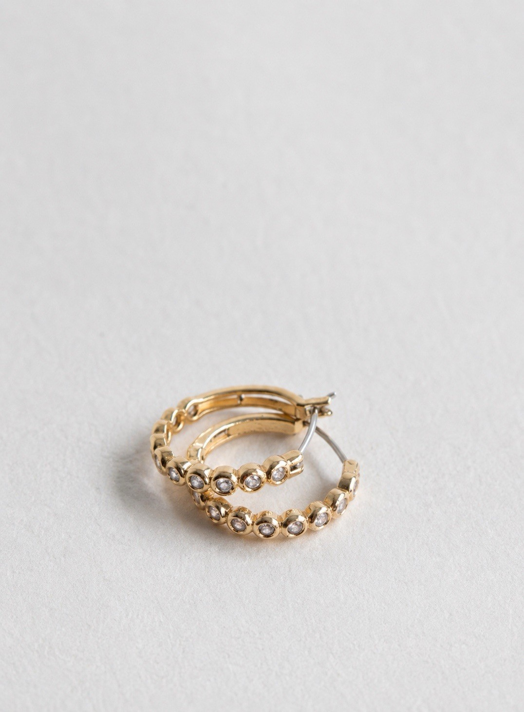 Kate spade Gold Tone Huggie Hoop Earrings w/ Clear Round Bezel Set Crystal