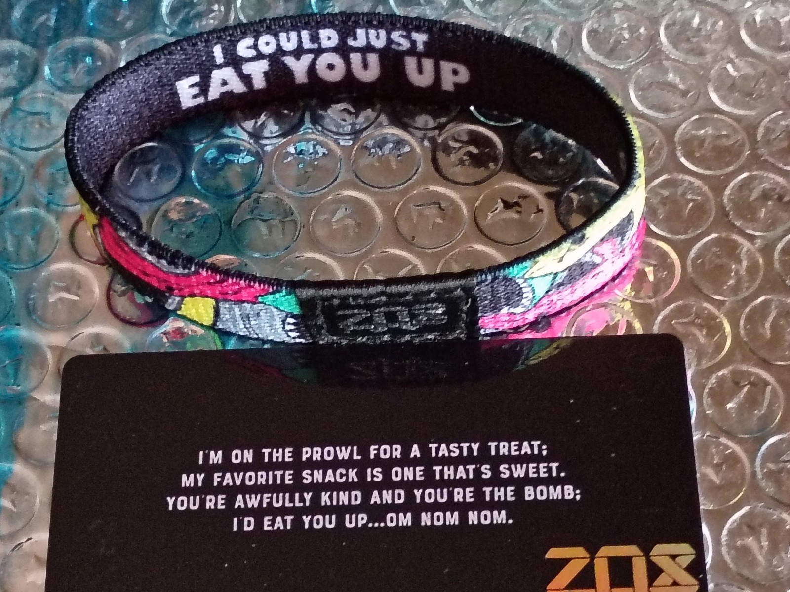 ZOX “I COULD JUST EAT YOU UP” Strap W/ Card. (Size Medium) -Silver