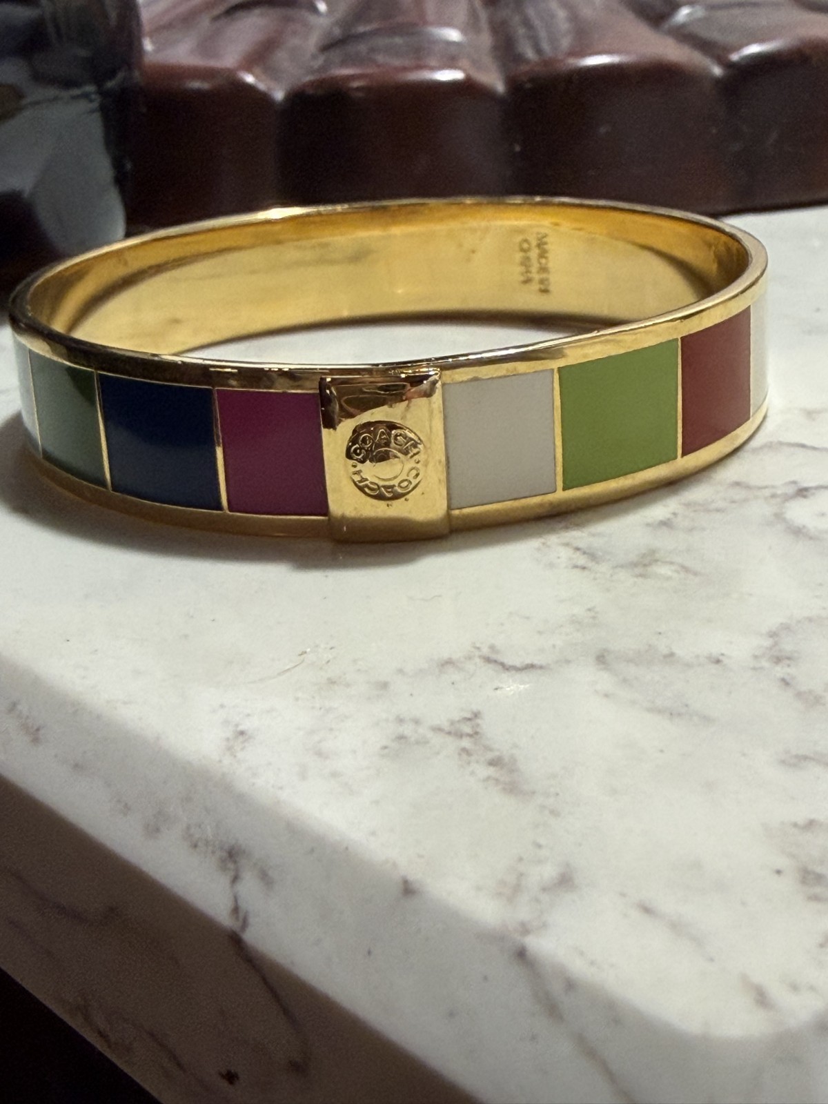 Coach enamel Goldtone w logo colored striped bangle bracelet