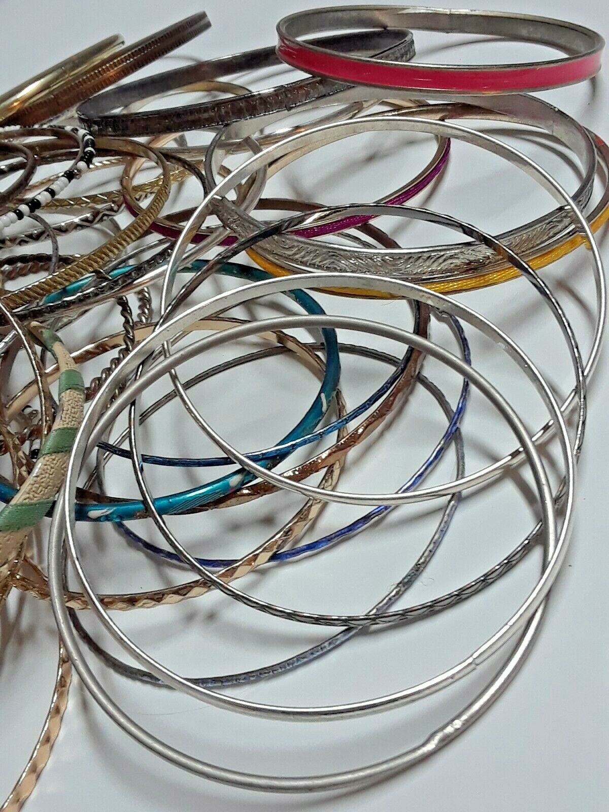 Bangle bracelets. gold tone silver tone, metal, plastic, with patterns. Lot