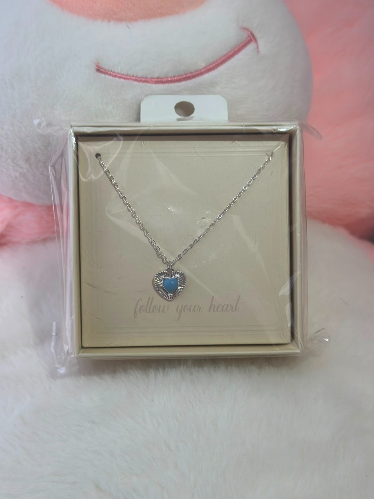 A smooth, rust-resistant silver chain featuring an elegant and attractive blue h