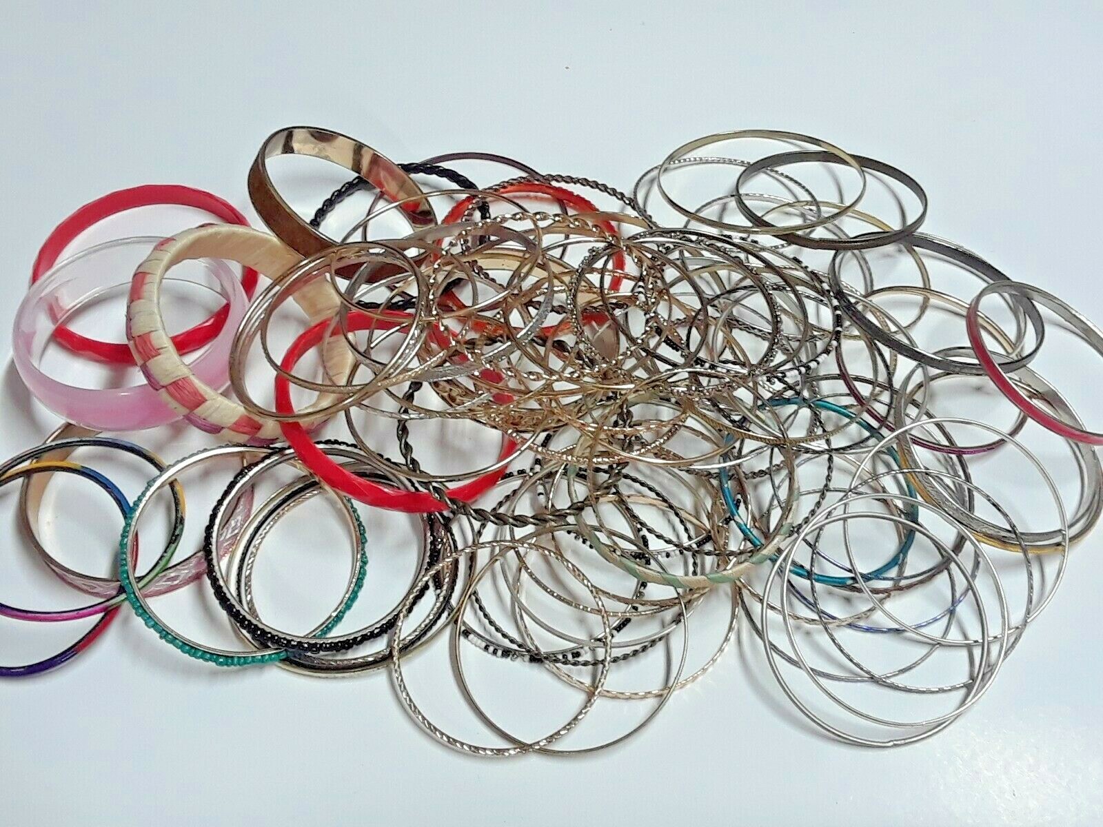 Bangle bracelets. gold tone silver tone, metal, plastic, with patterns. Lot