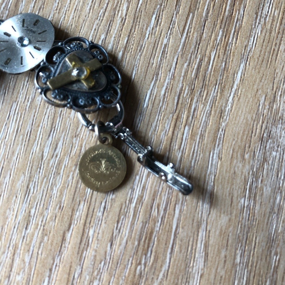 Artistic Silver and Gold Watch Face and Cross Bracelet