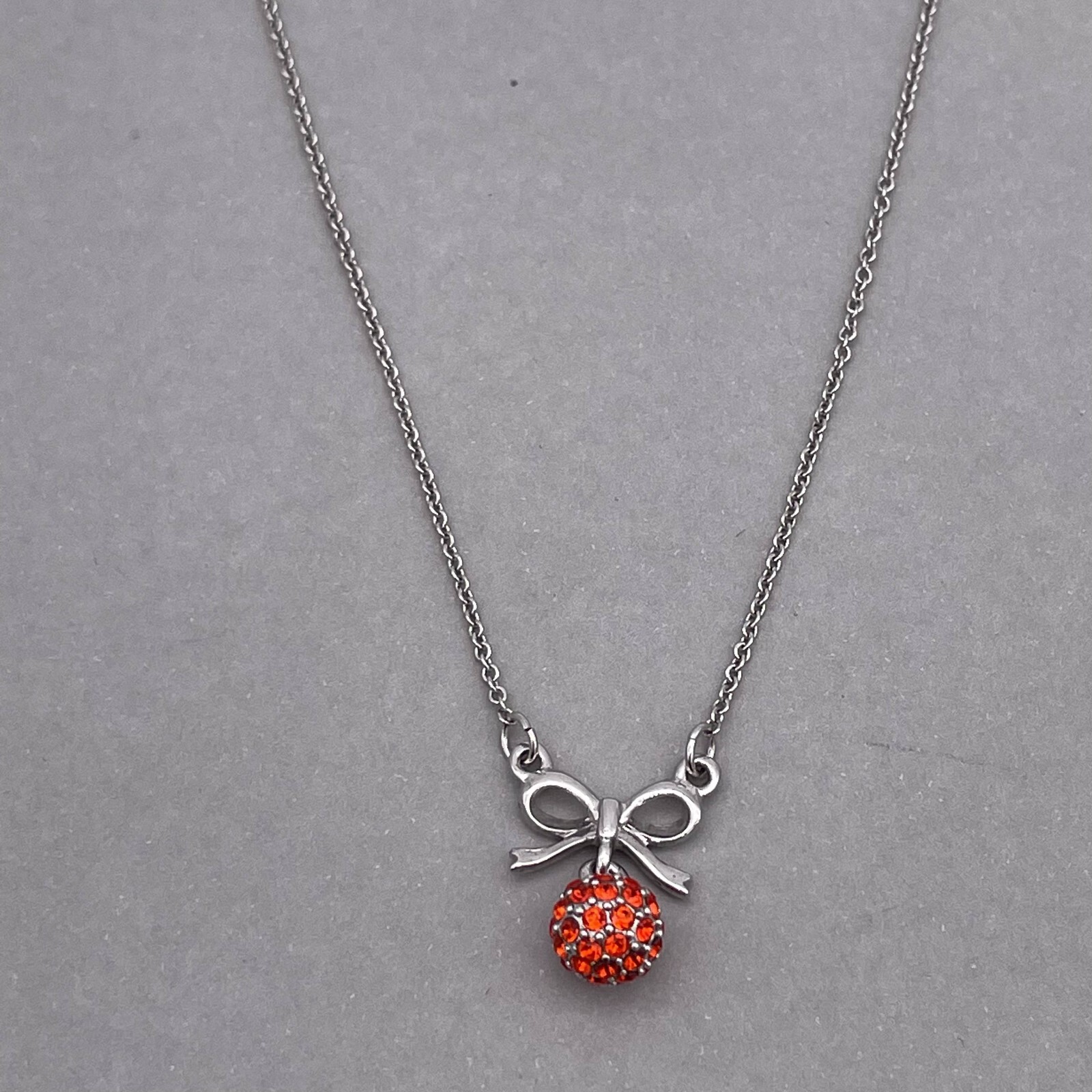 Clue Rhinestone Ball and Bow Link Chain Necklace Silver Tone 15 to 17 in