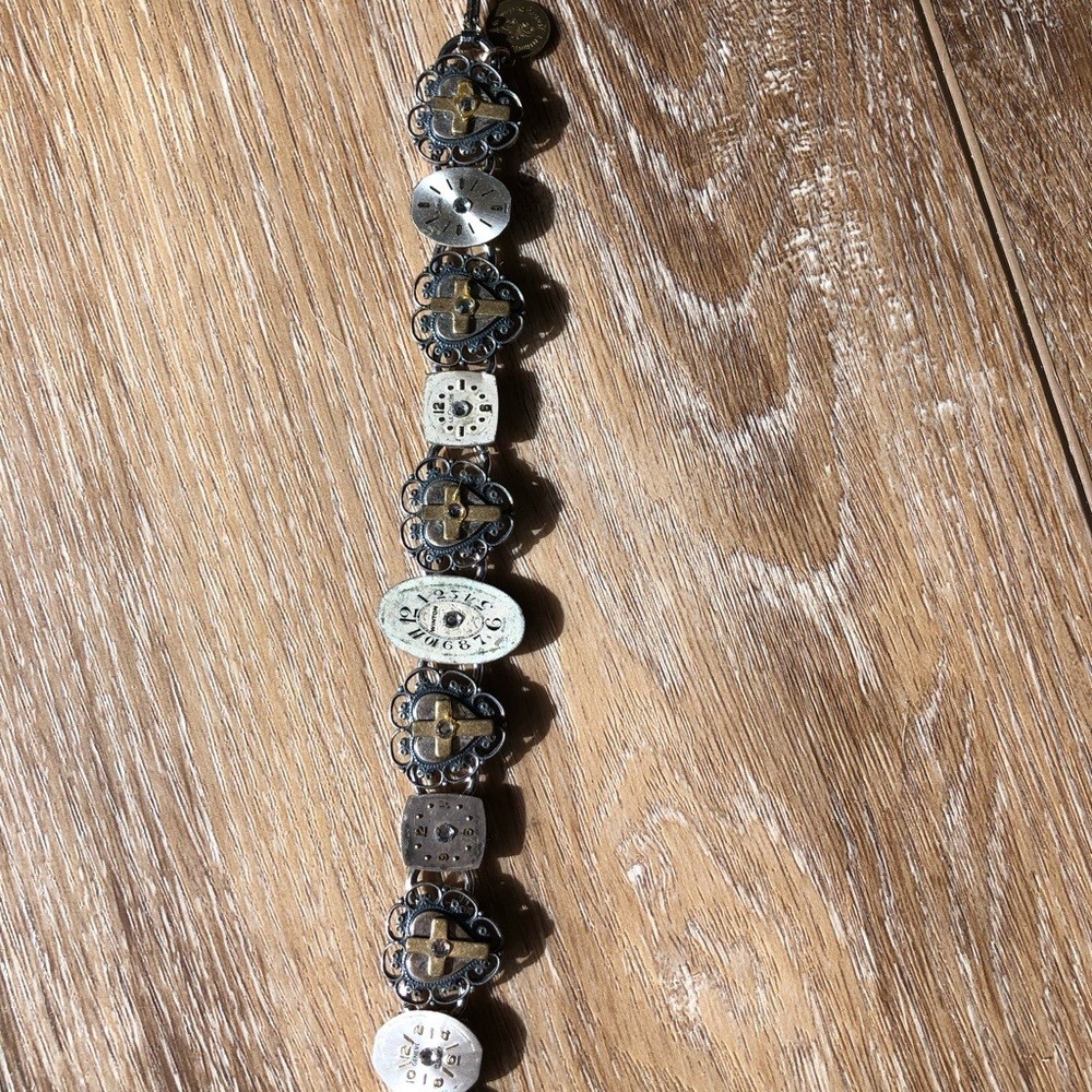 Artistic Silver and Gold Watch Face and Cross Bracelet