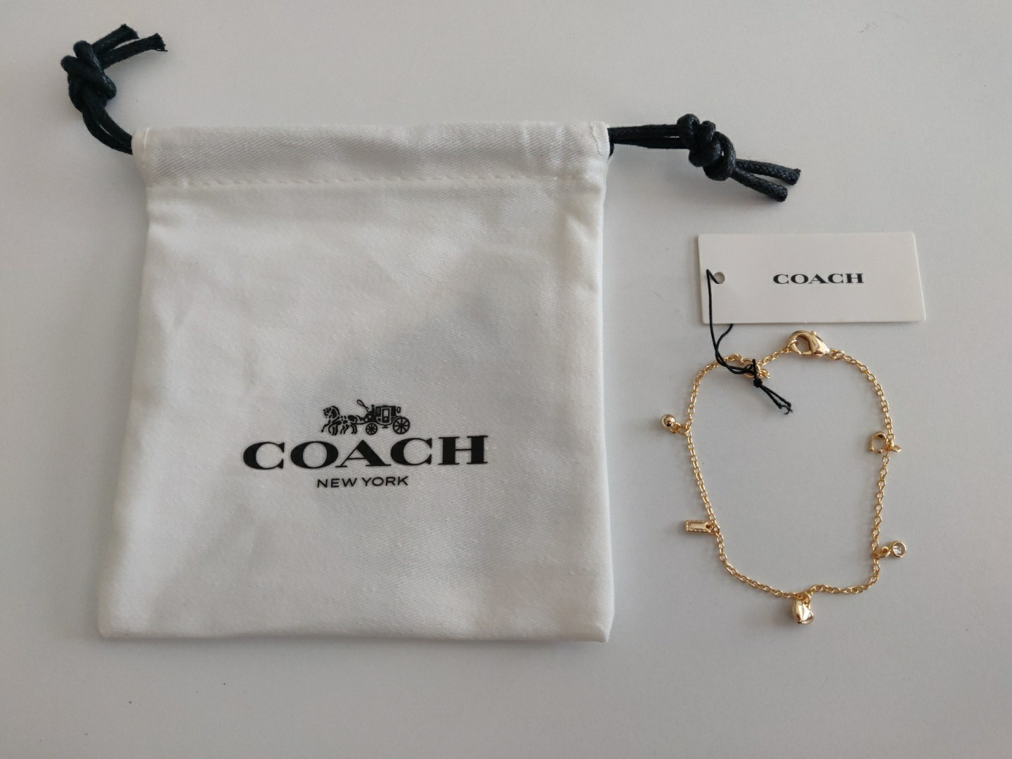 Coach Gold Tone Charm Bracelet Heart Horseshoe Crystal Bracelet NWT includes bag
