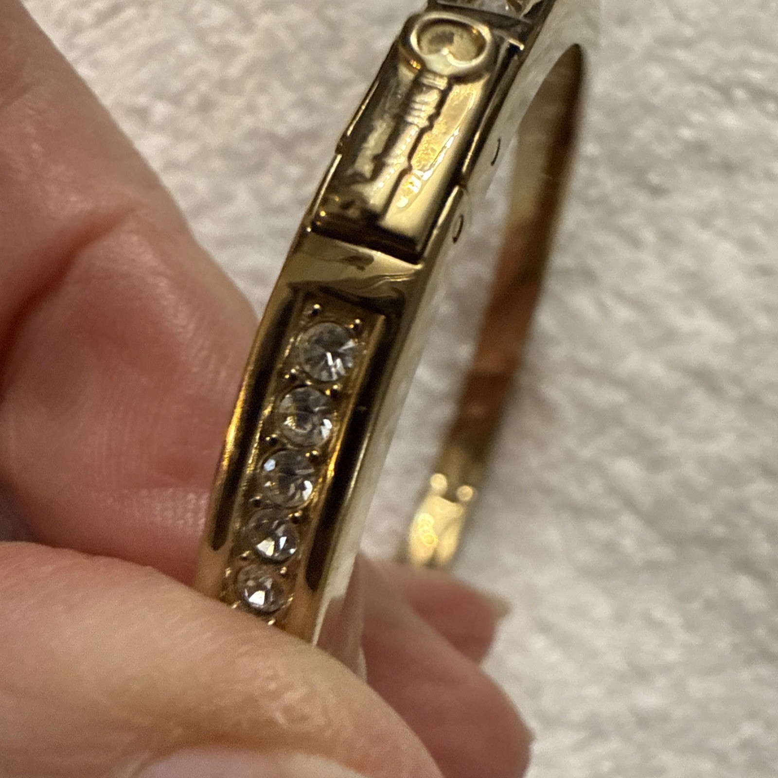 Fossil Brand Gold tone latch closure bangle with white stones