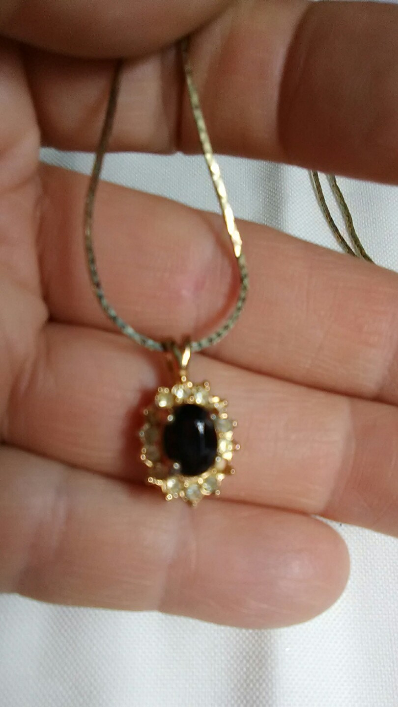 Garnet surrounded by cubic zerconia pendant January birthstone