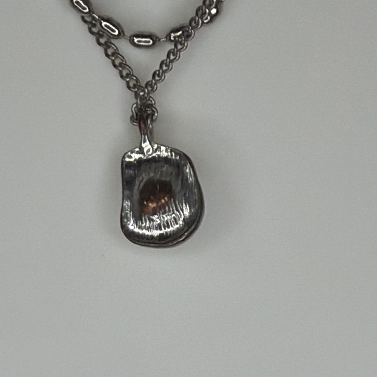 Double strand, gunmetal necklace with Central Pearl pending