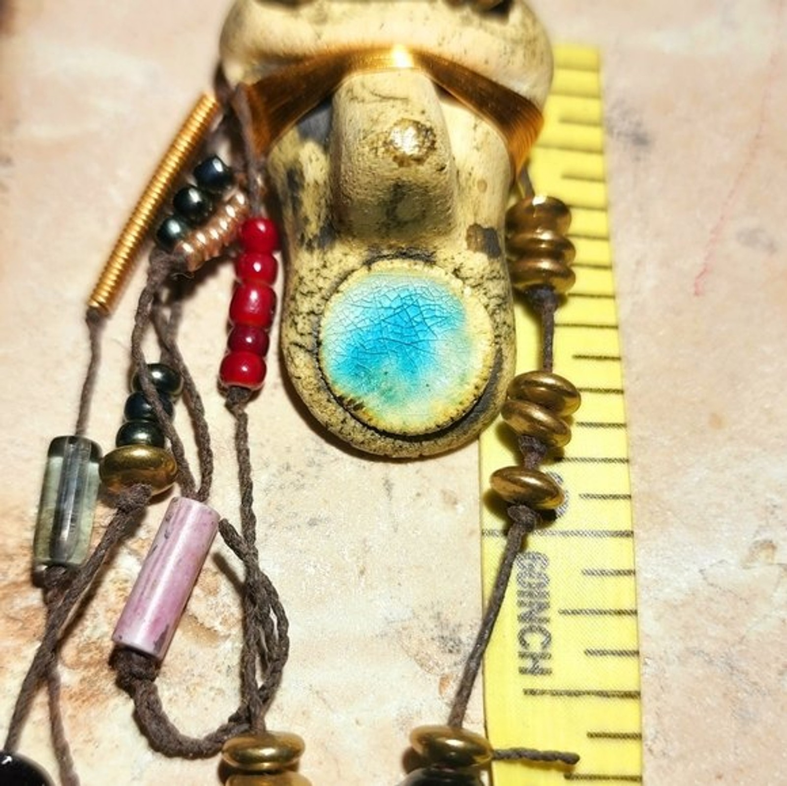 Abstract tribal brutalist face with locs like hair artisan brooch