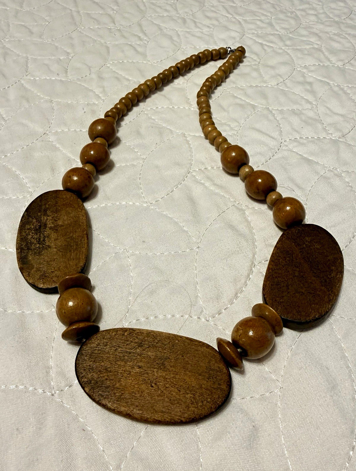 Bohemian brown wood beaded necklace w/ oval pendant, adjustable, 23”length.