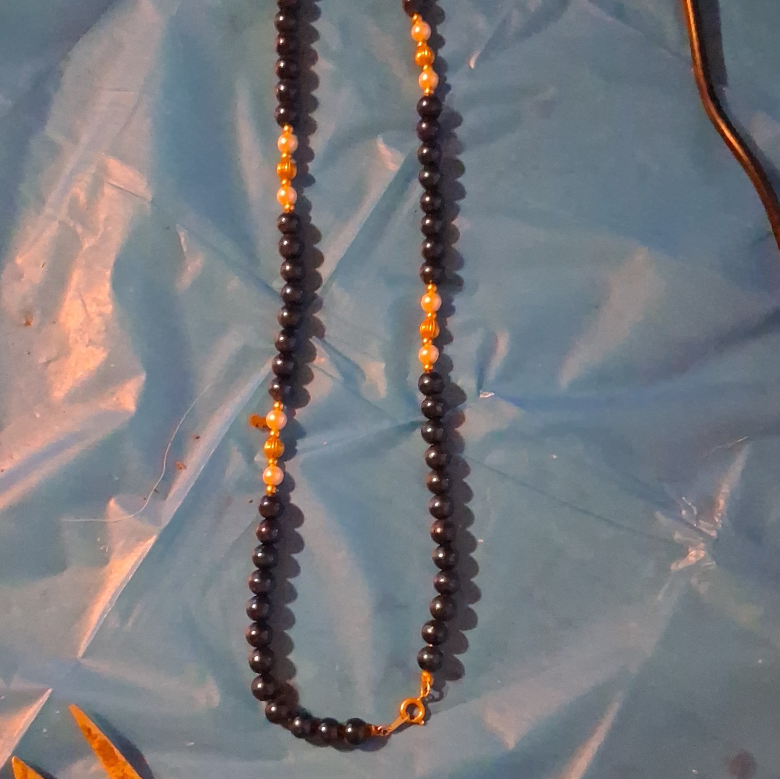 Black Beaded Necklace with Gold Tone Bead Accents, Spring Ring Clasp