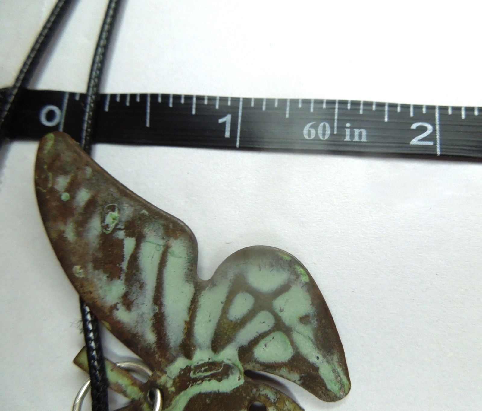 oxidized copper butterfly pendant on black faux leather cord upcycled