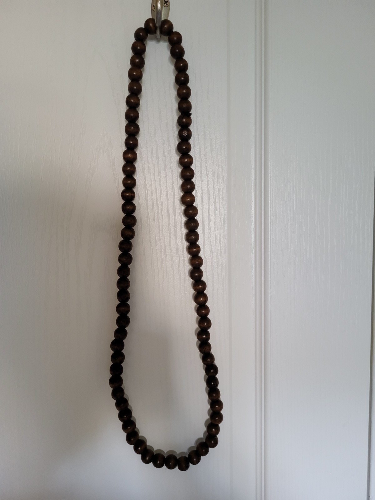 Long wooden bead necklace made of dark brown beads 37in