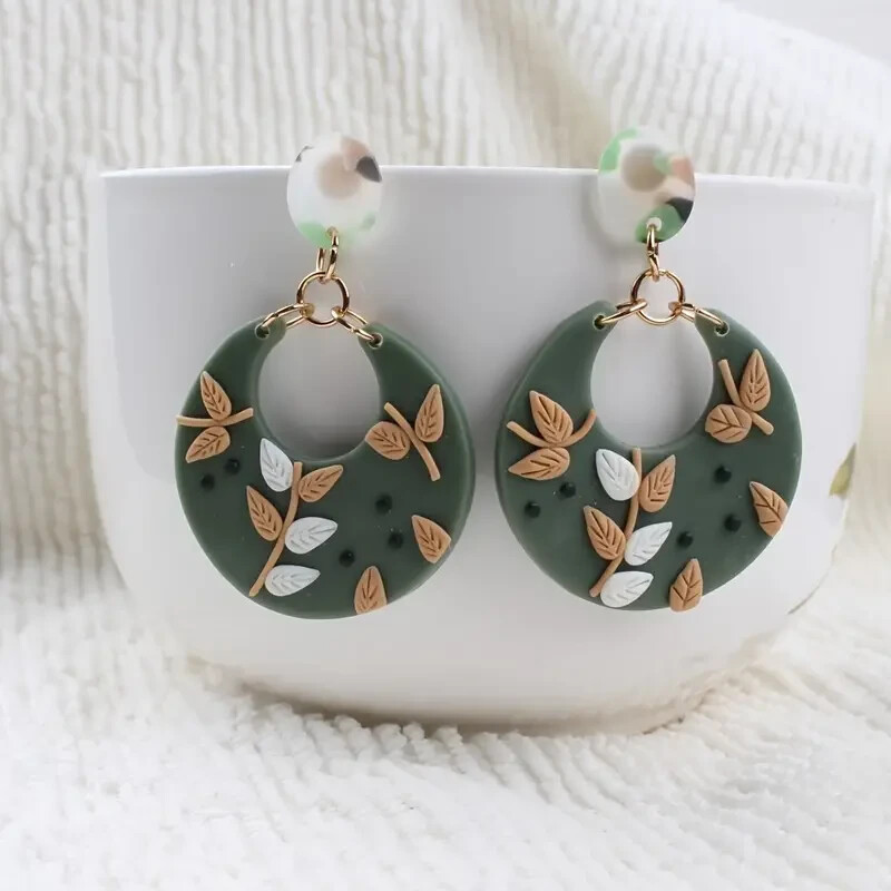 Gold tone polymer clay round green with leafy vine dangle earrings 2 1/2″