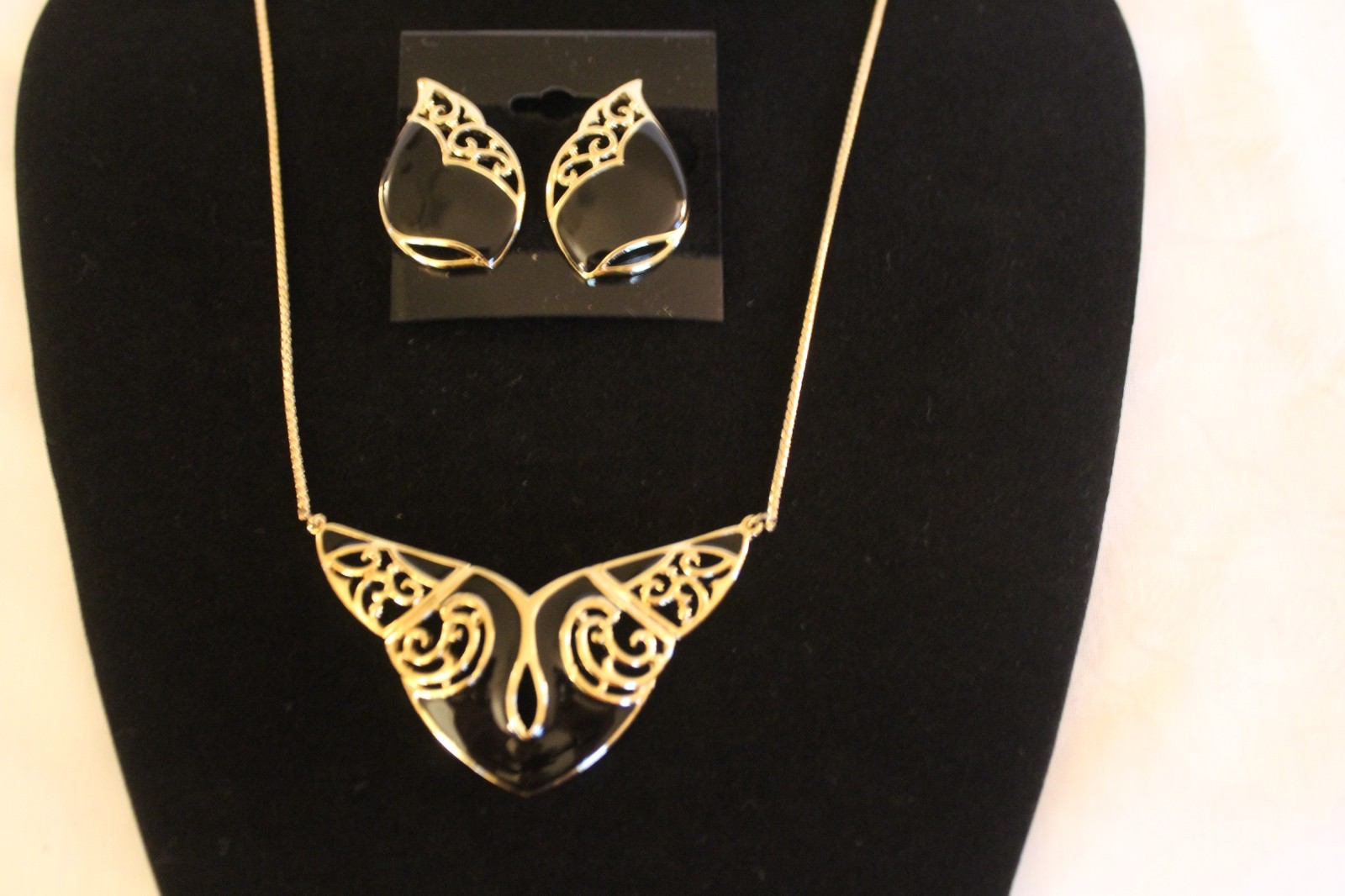 Filligree style necklace 17in and earrings. Gold plated with black emerald inlay