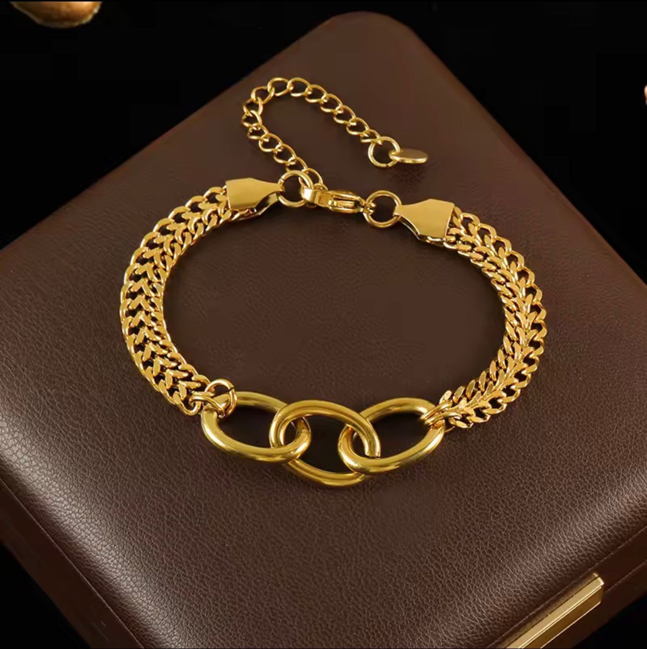 A Luxurious Bracelet With Two Chains And Interlocking Links In A Modern Design