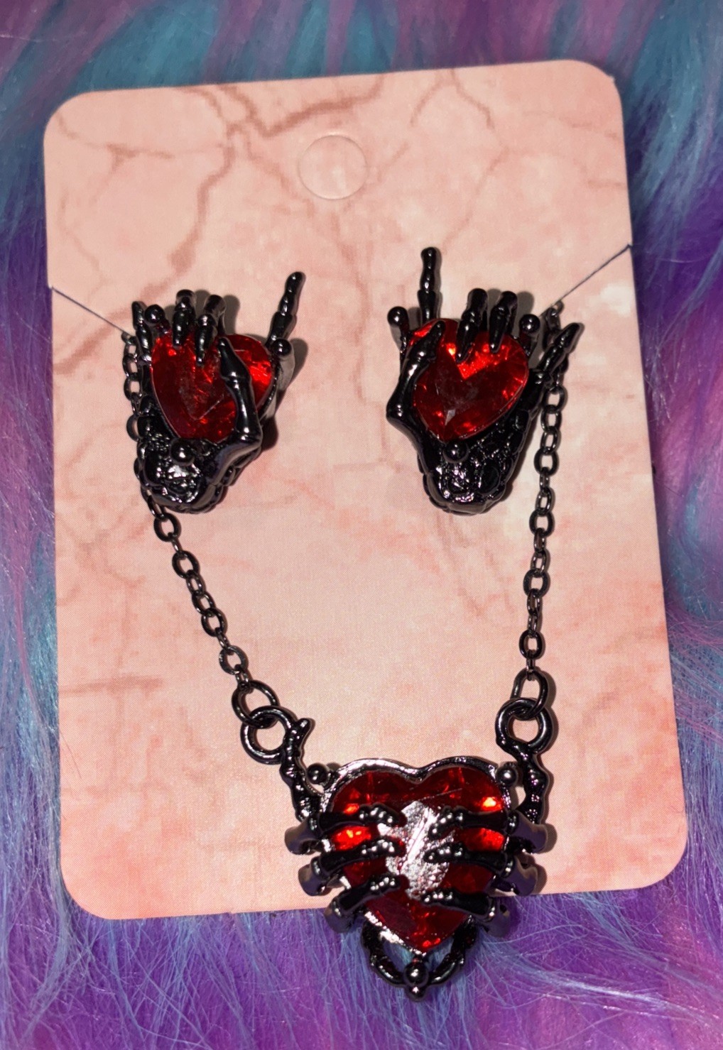 Gun Metal Skeleton Hand Holding Heart Signing I Love You. Halloween, Valentines