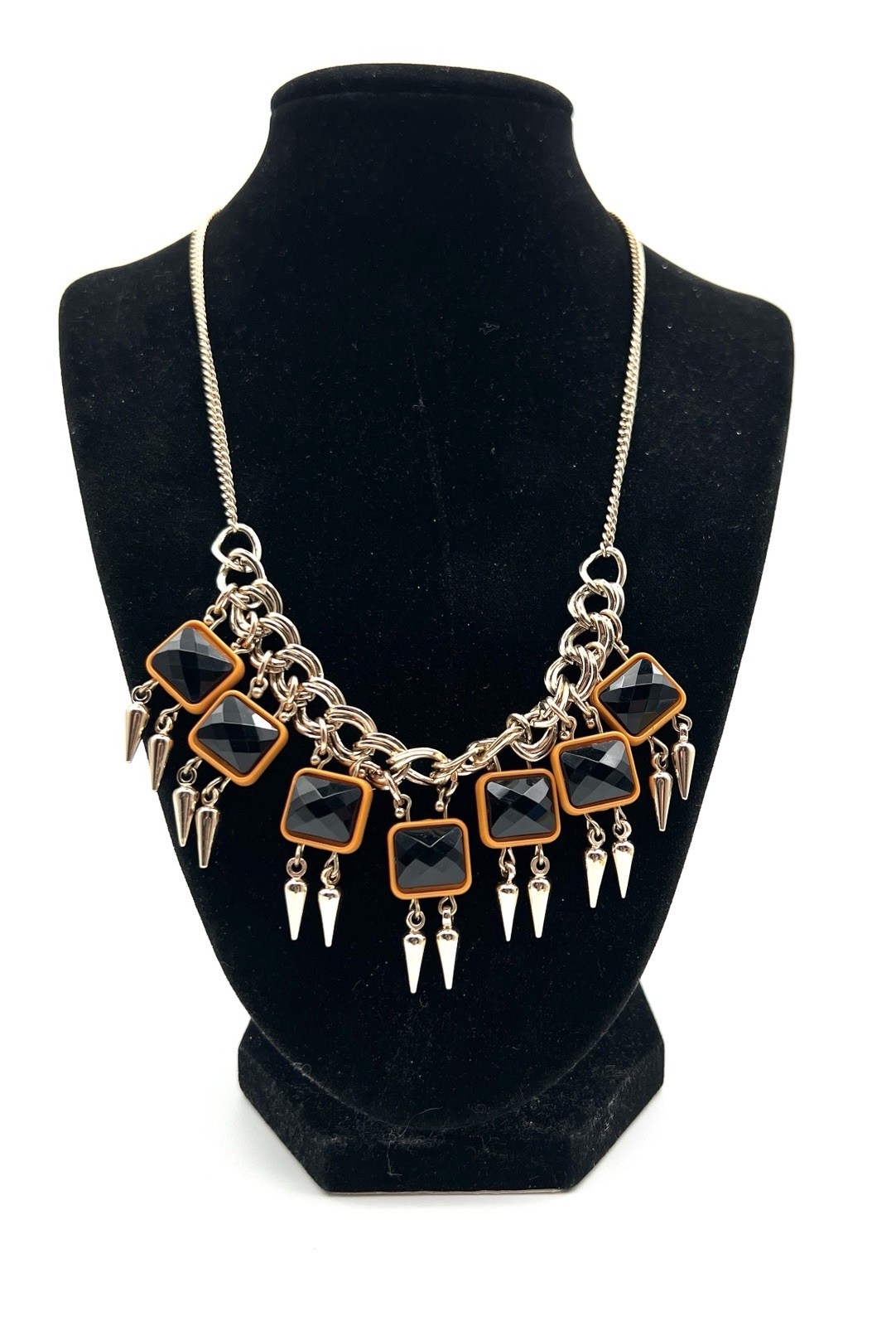 Silver Tone Bib Necklace features Black & Orange Acrylic Gems