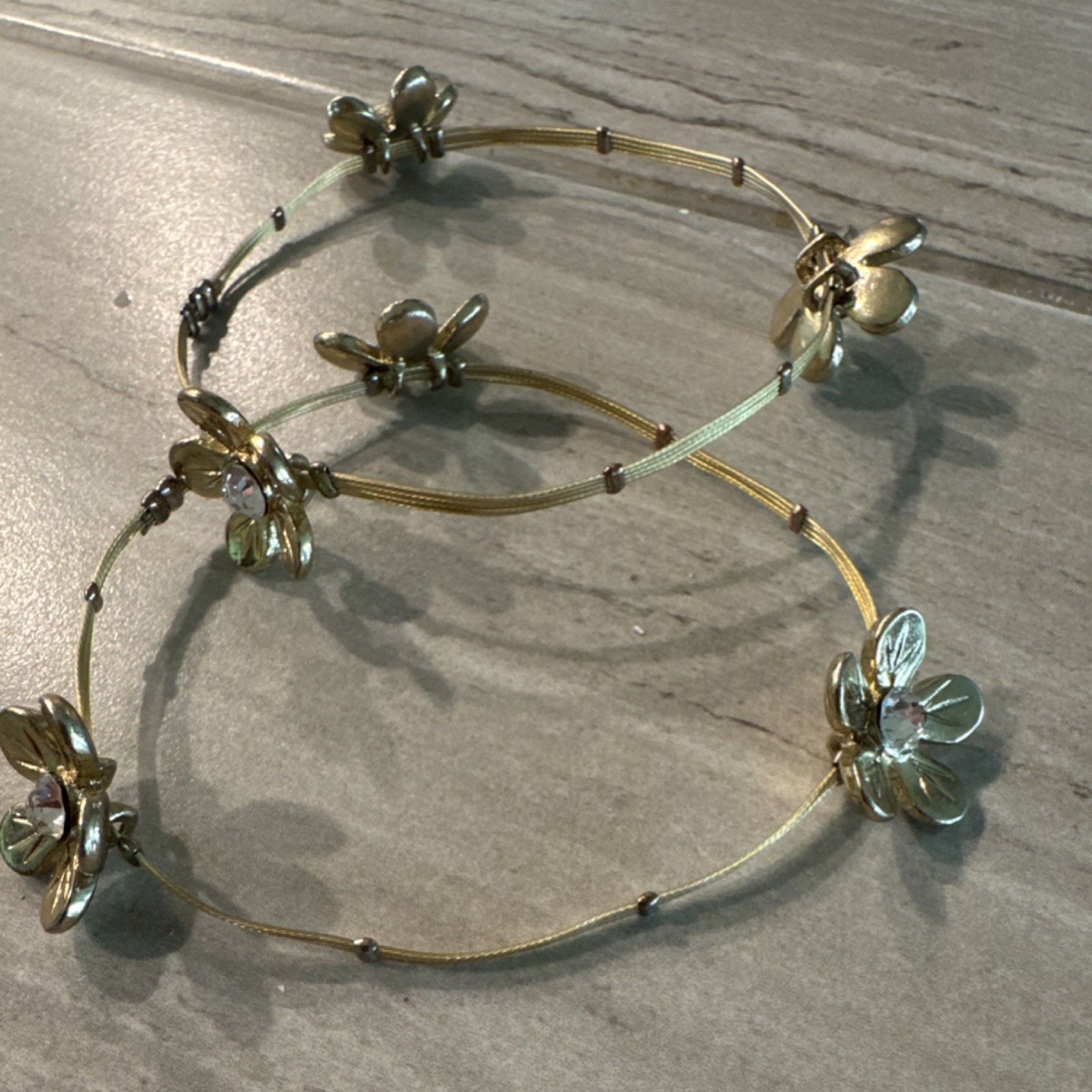Lot of 2 Gold Tone Wire Bangle Bracelets Flower Dangle Charms Clear Stones