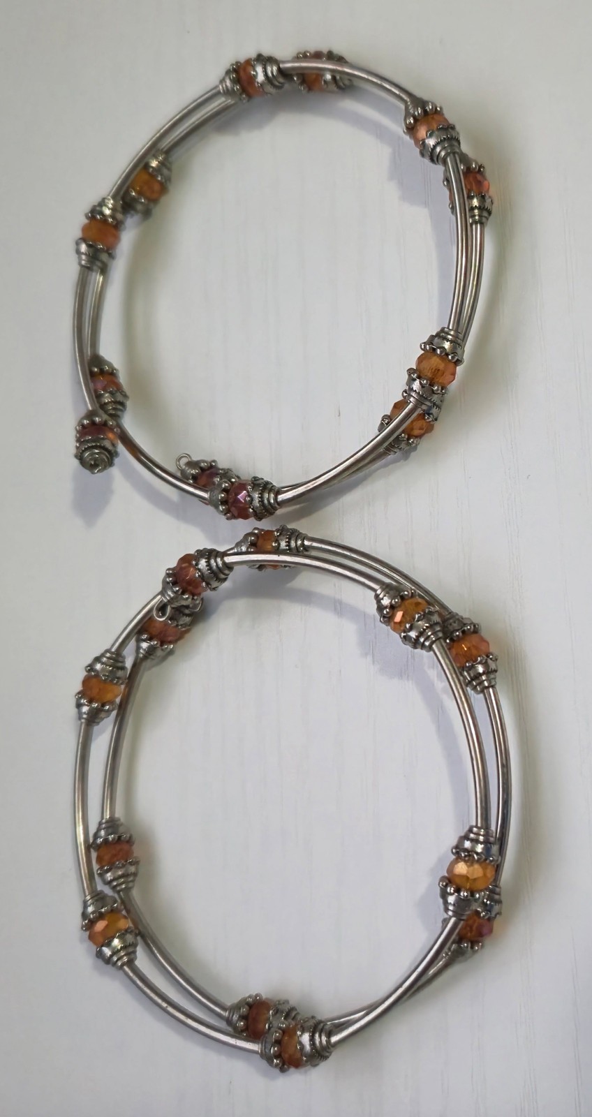 Set of 2 Silver Memory Wire Wrap Bracelets Amber Orange Iridescent Glass Beads