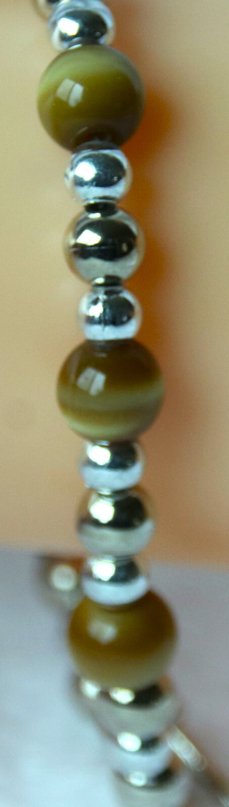 Bracelet of Brown Cat’s Eye Glass with silver colored beads, toggle closure
