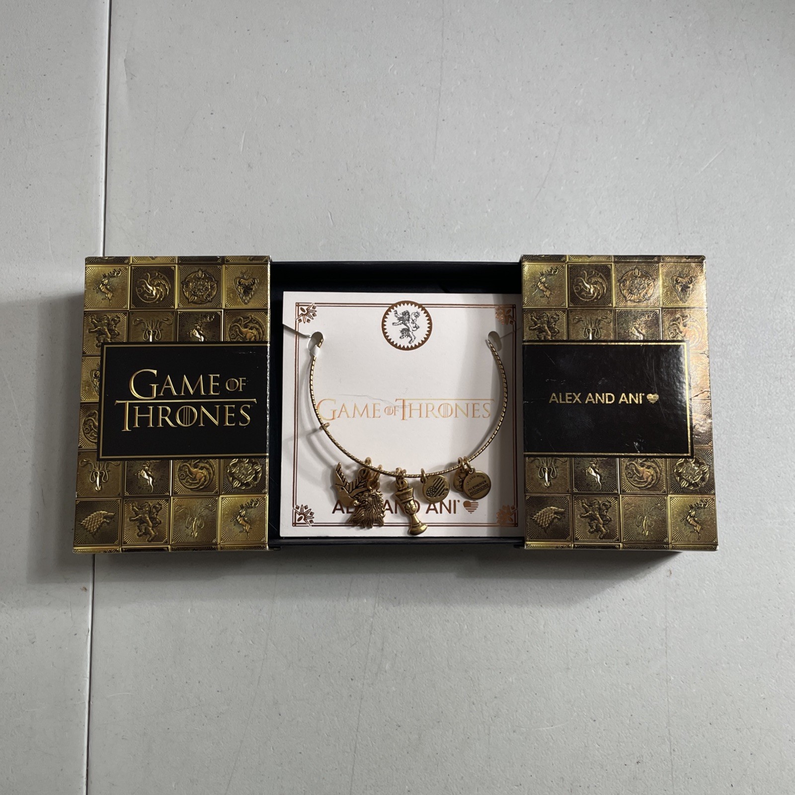 Alex and Ani Game of Thrones Gold Tone Bangle Charm Bracelet — Cersei Lannister