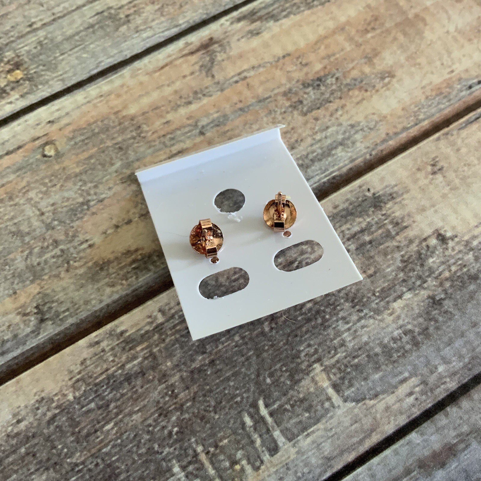 Man made faux opal crown setting rose gold colored stud earrings